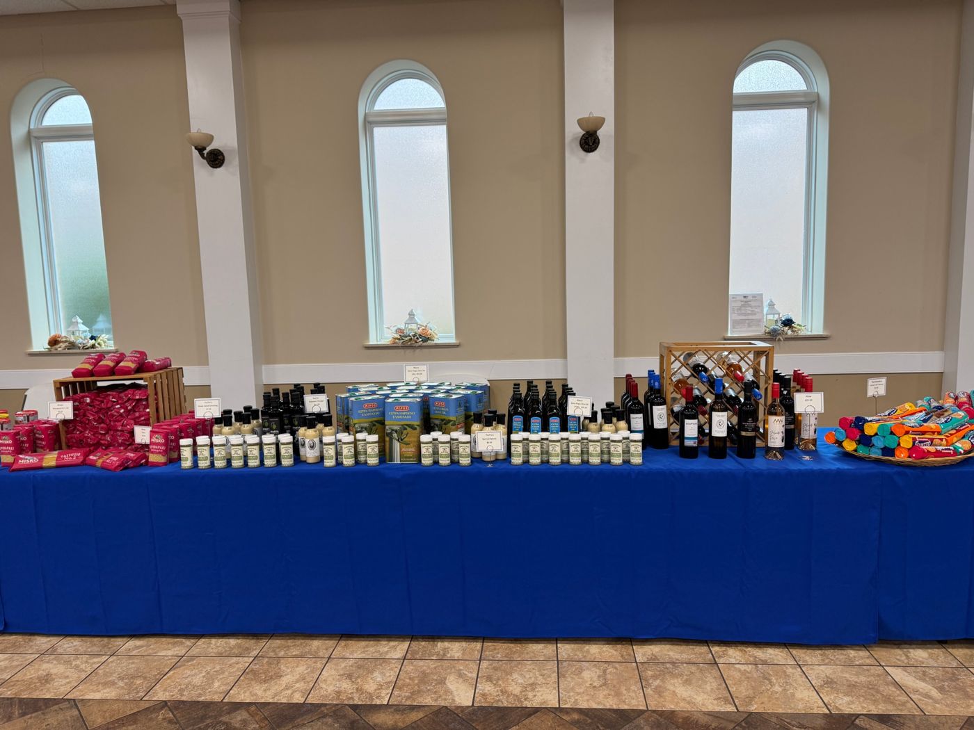 Imported olive oil, spices, pasta, and Greek wine on the market table