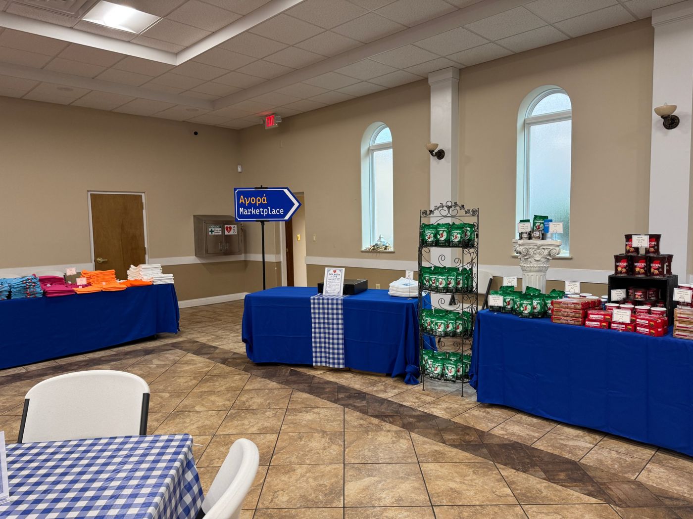 The Agora Marketplace sign and market tables